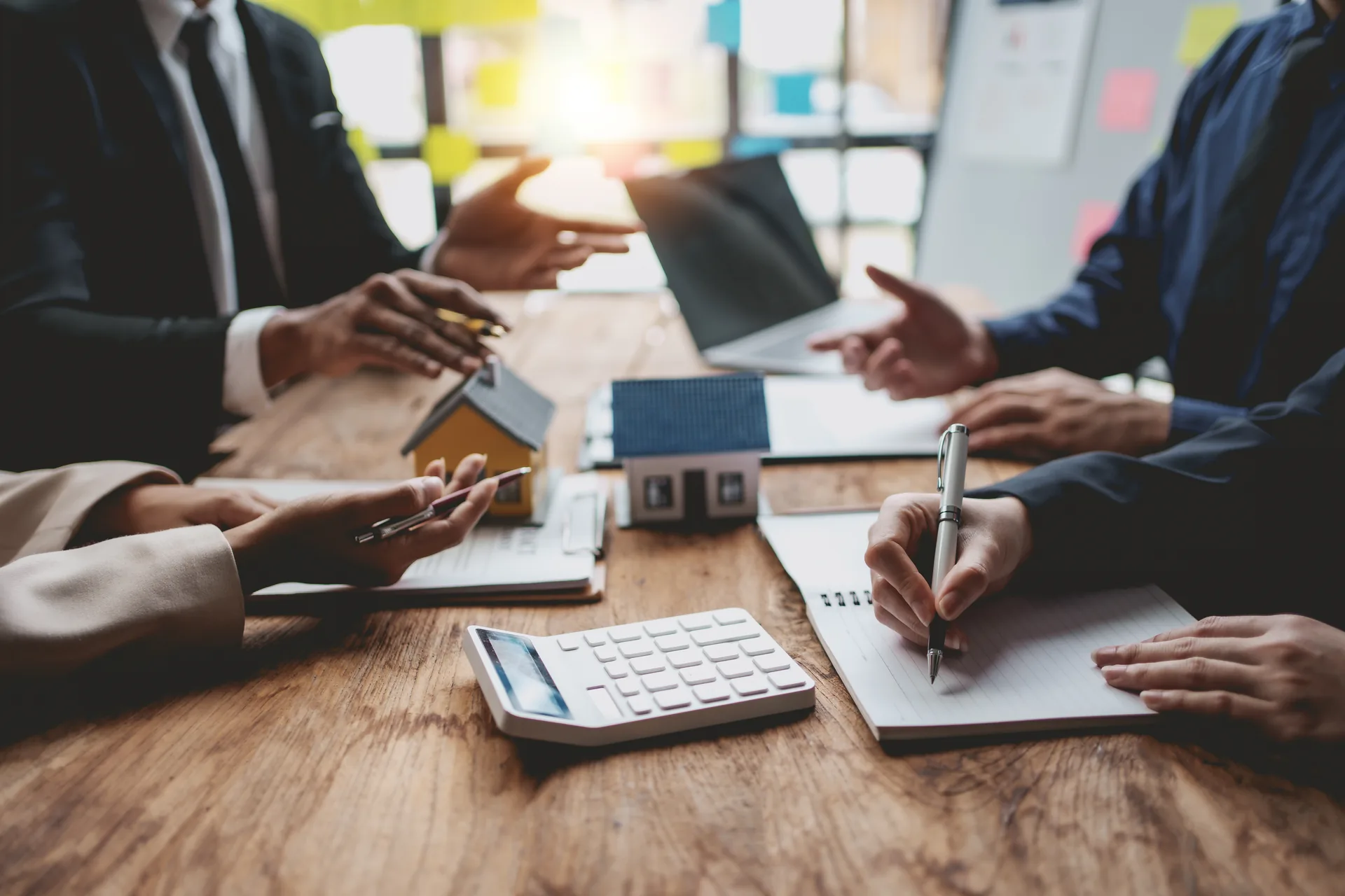 Investors comparing property costs, returns and risks