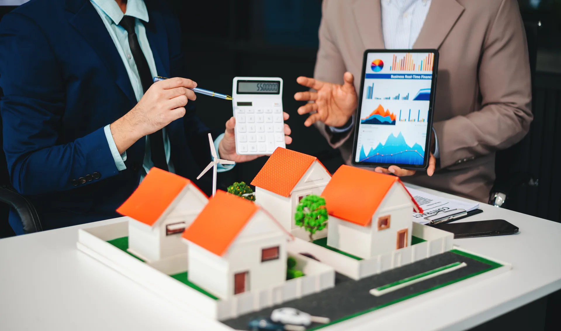 Investors reviewing property income, costs and financial data