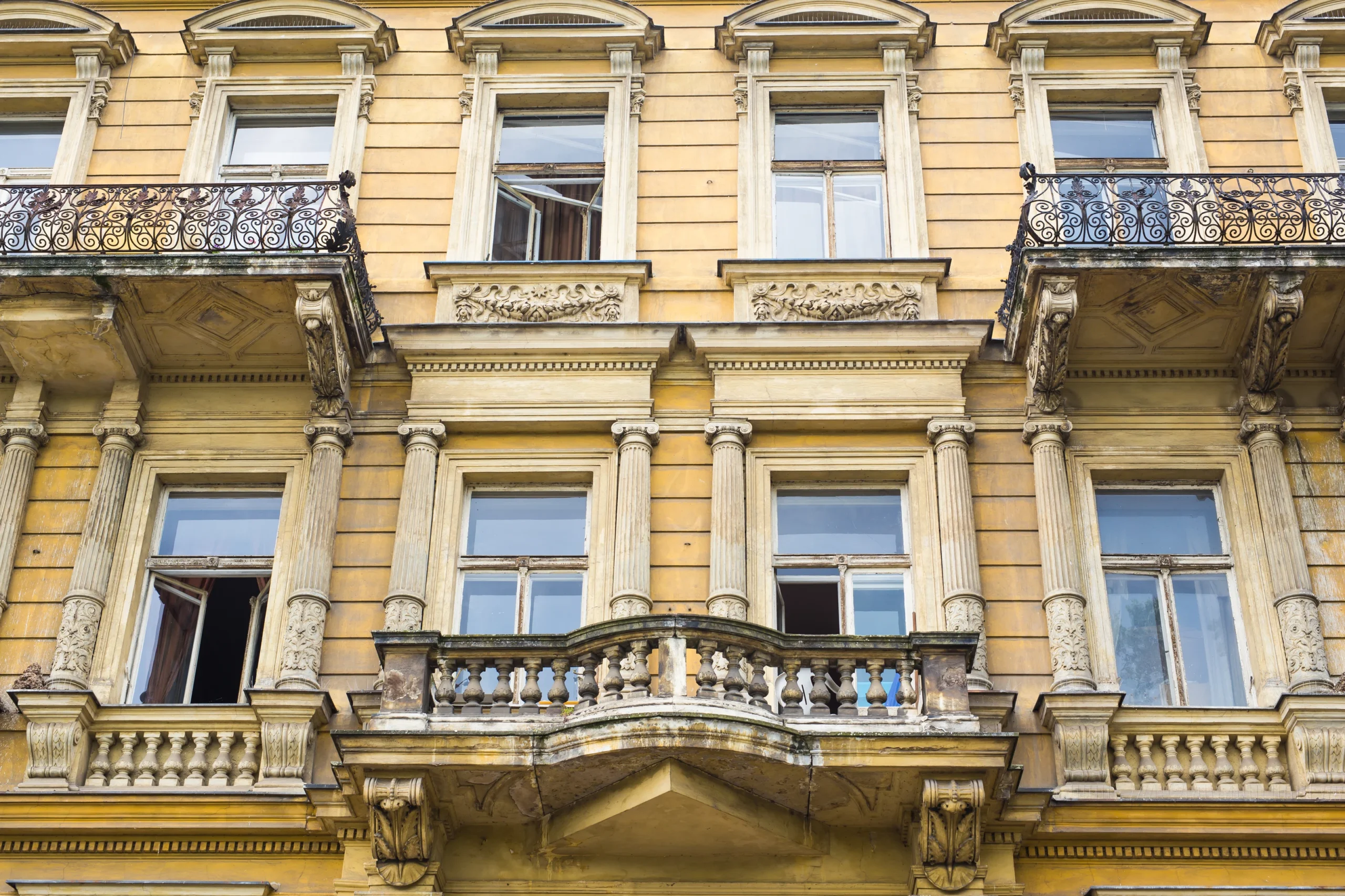 Budapest apartment buildings illustrating the city benchmark behind the PFC Index comparison.